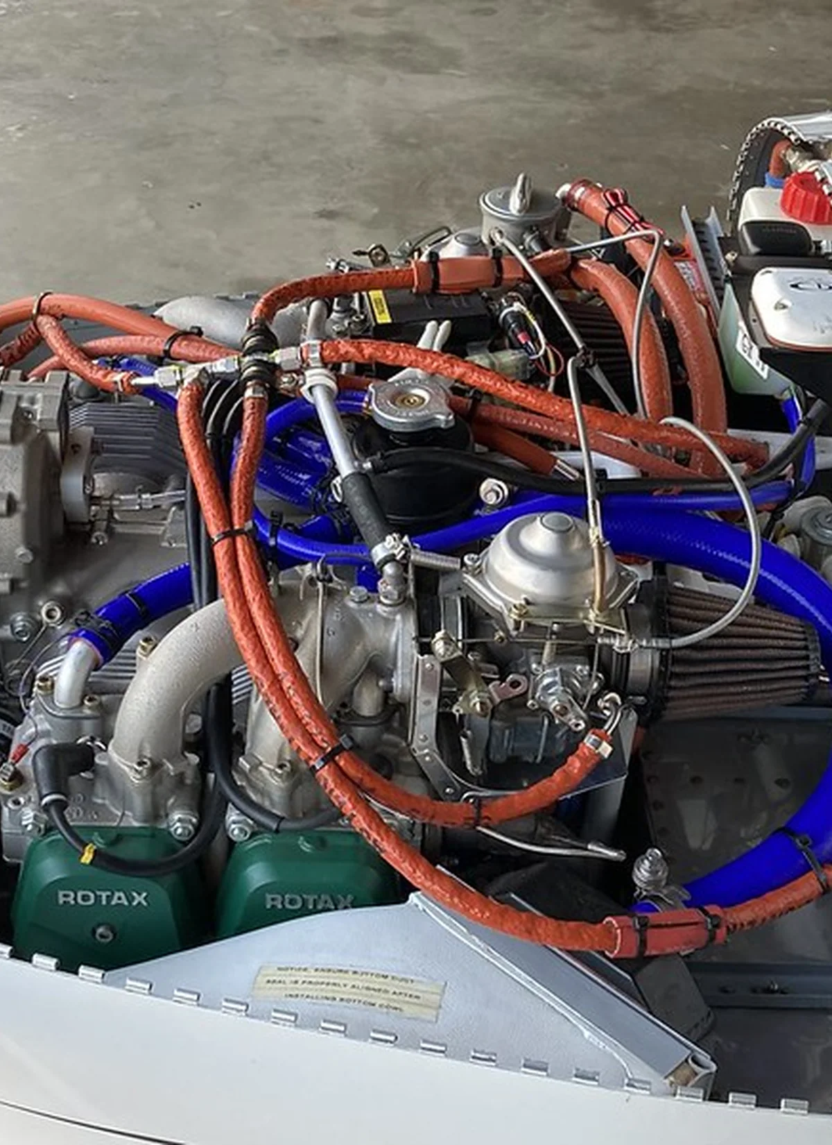 Installed ROTAX hose routing and rubber replacement review area